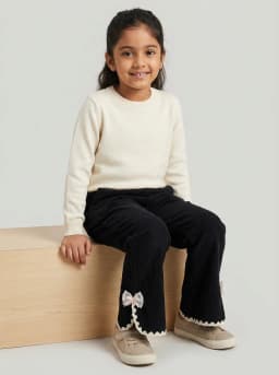 Girls Black Corduroy Flared Trousers with Lace Trim and Bow Accent