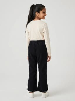 Girls Black Corduroy Flared Trousers with Lace Trim and Bow Accent